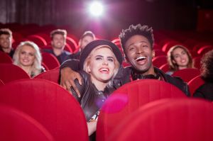 Multi ethnic couple in the movie theater