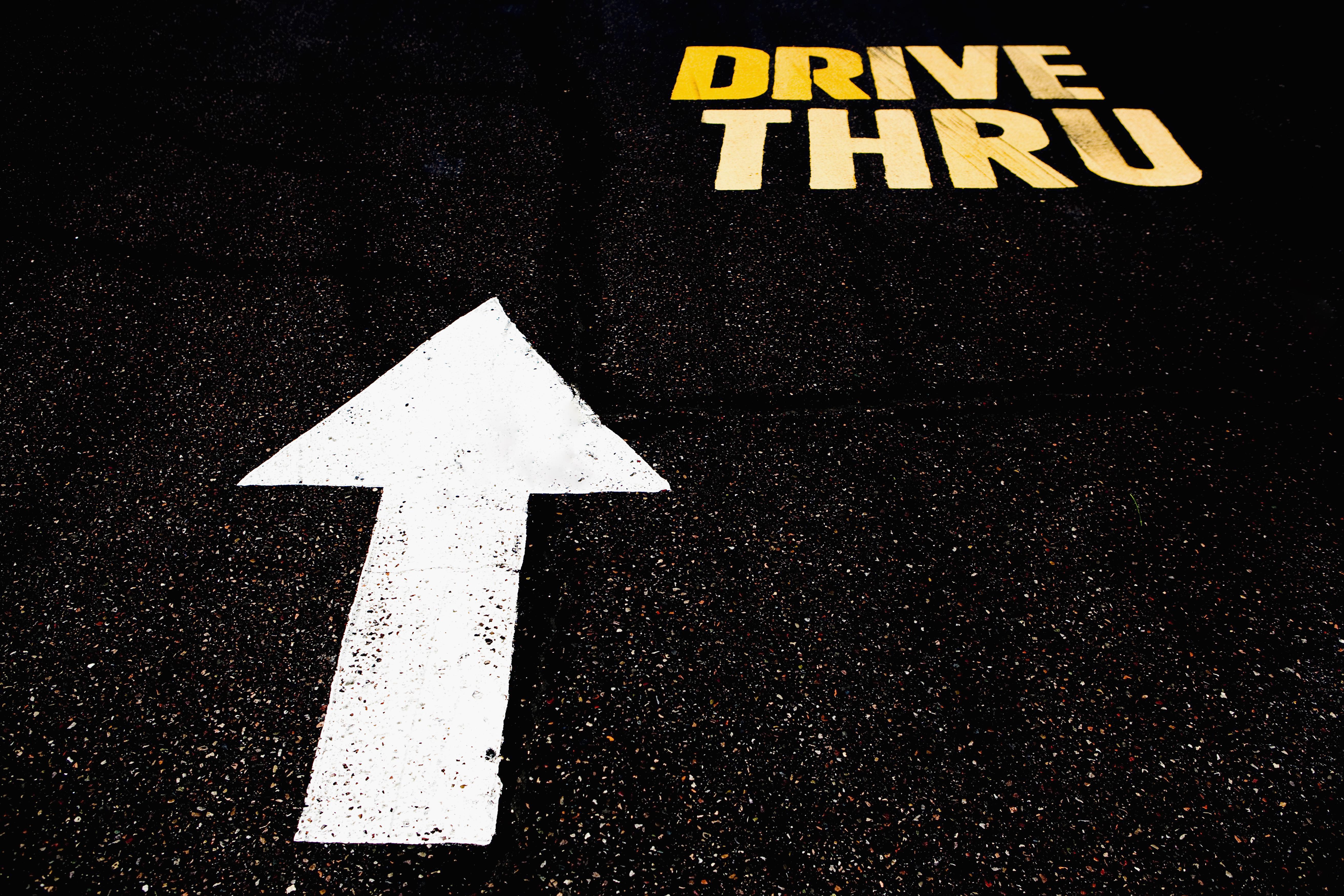 Drive Thru sign on the road